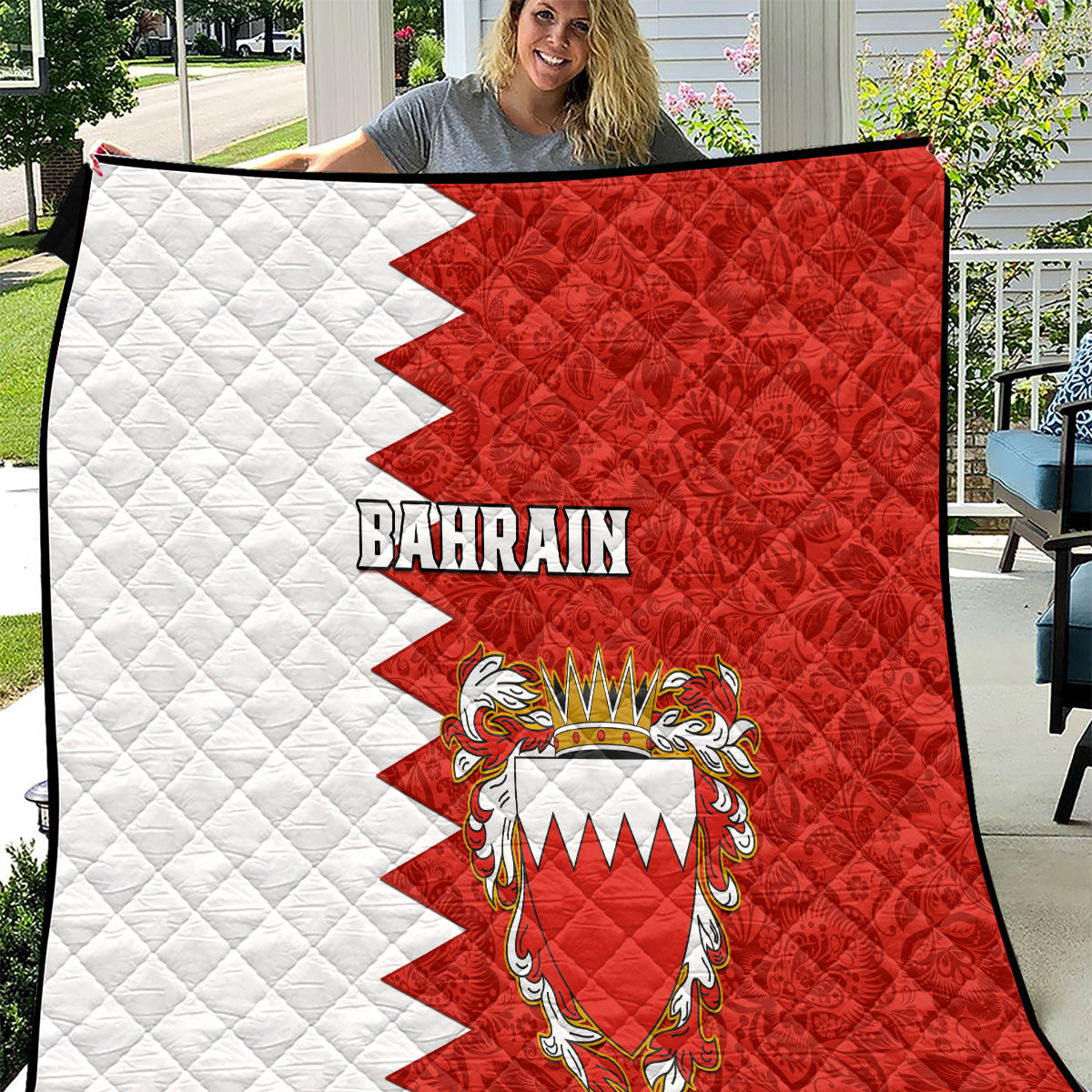 Red and white Bahrain quilt with quilted texture and coat-of-arms graphic