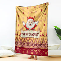 Yellow Christmas blanket with Santa and 'New Jersey' text, red tree and diamond pattern