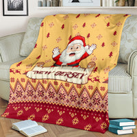 Yellow Christmas blanket draped on sofa with Santa and 'New Jersey' sign and tree motifs