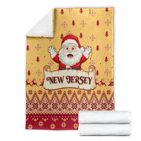 Yellow New Jersey Christmas blanket flat lay with Santa, trees, and red geometric border