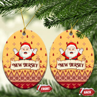 Yellow oval ceramic Christmas ornaments with Santa and "NEW JERSEY" text, hanging