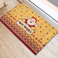Yellow holiday doormat featuring Santa and 'New Jersey' logo with geometric red border