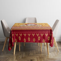 Christmas tablecloth on square table with gold center and red Nordic-style pattern