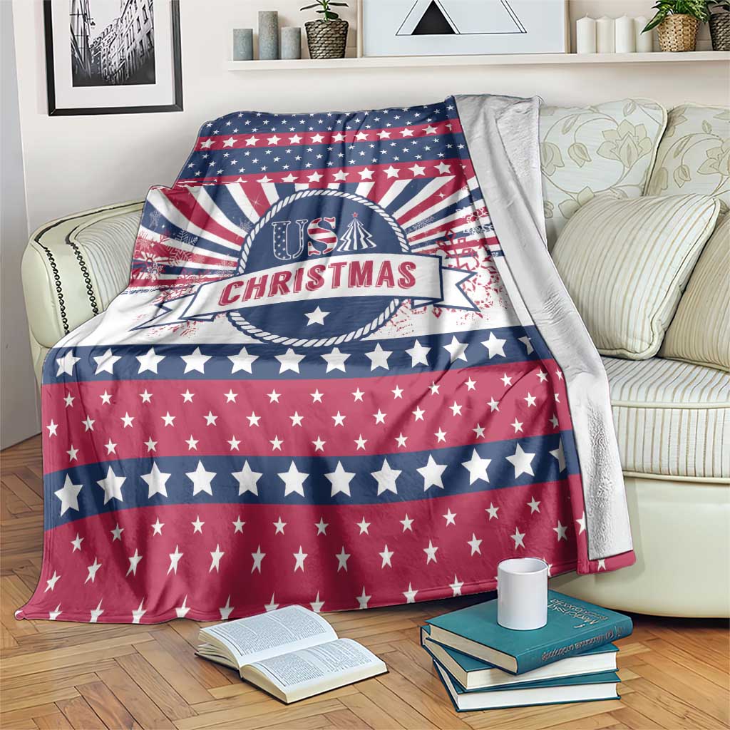 USA Christmas blanket draped on a couch with US CHRISTMAS emblem and star stripes