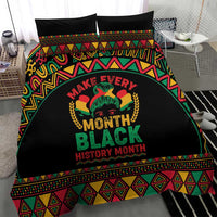 Black bedding set showing “Make Every Month Black History Month” text with colorful patterned bands