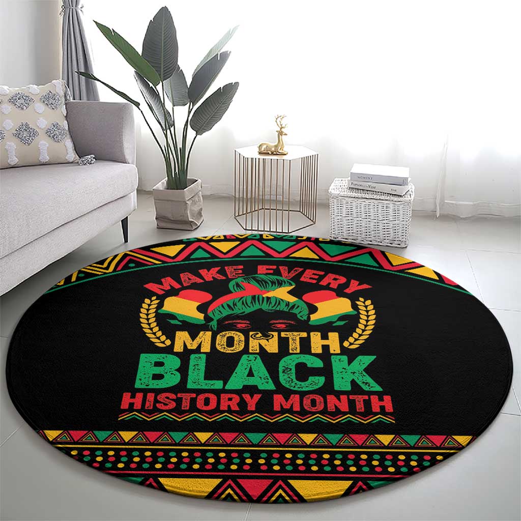 Round black rug featuring large 'MONTH BLACK HISTORY MONTH' lettering and African motif border