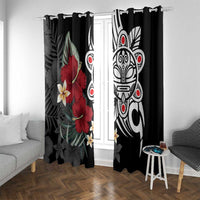 Black curtain panels with red hibiscus and white tribal mask motifs hanging from a rod