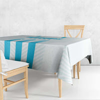 Blue striped tablecloth with hanging corner drape over table