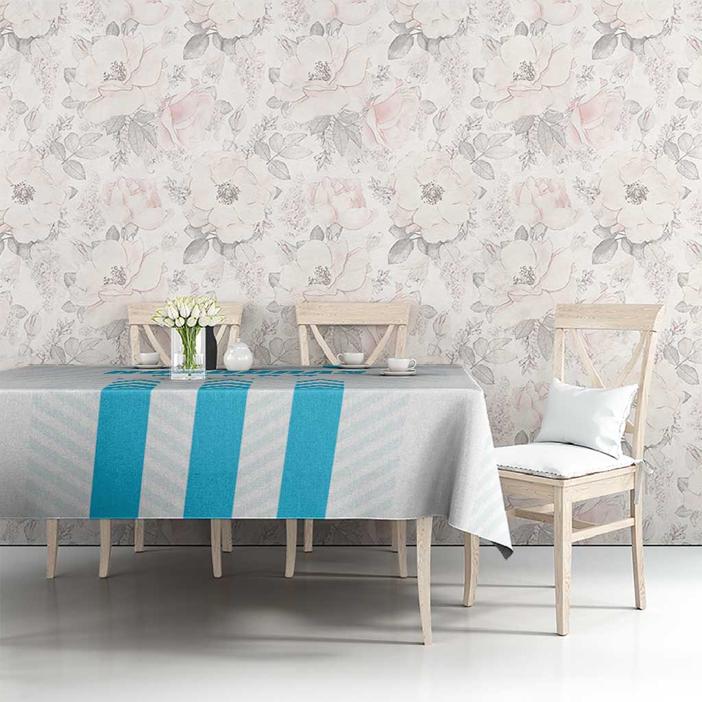 Blue striped tablecloth on rectangular dining table with chairs