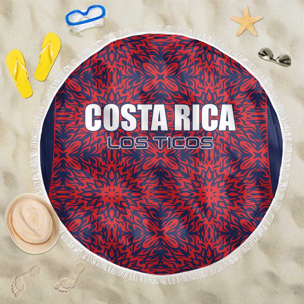 Round beach blanket with red-and-navy starburst pattern, 'COSTA RICA LOS TICOS', white fringe