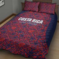 Red and dark blue Costa Rica-themed football quilt bed set on a bed with two pillows