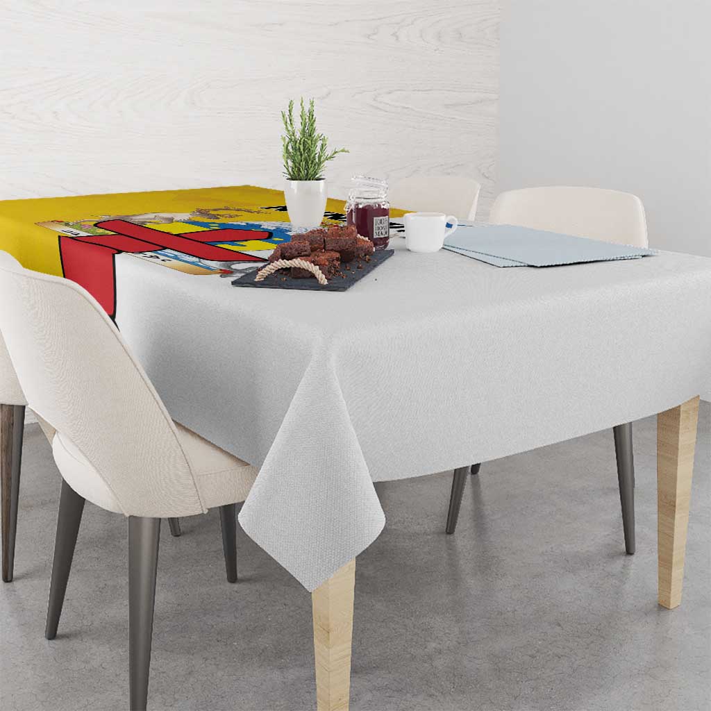 Gray tablecloth with colorful edge panel and small dining centerpiece on table.