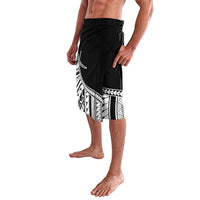 Black lavalava with Polynesian tattoo pattern border on front, side drape fold