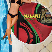 Round beach blanket with Malawi Independence Day design and white fringe, draped in poolside scene
