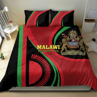 Malawi flag bedding set on bed: duvet with two pillows, red green black design and text.