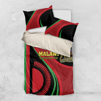 Malawi bedding set flat lay: duvet and two pillows with red, green, black flag graphics.