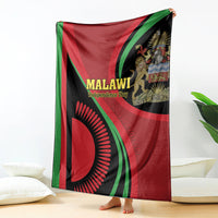 Malawi Independence Day blanket, draped red and black fabric with green stripes and lion crest