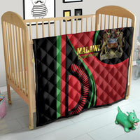 Black and red Malawi Independence Day quilt displayed on a bed with green accents