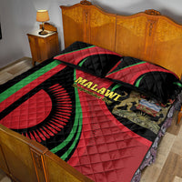Quilt bed set on bed with red, black, and green Malawi graphic and two pillow covers