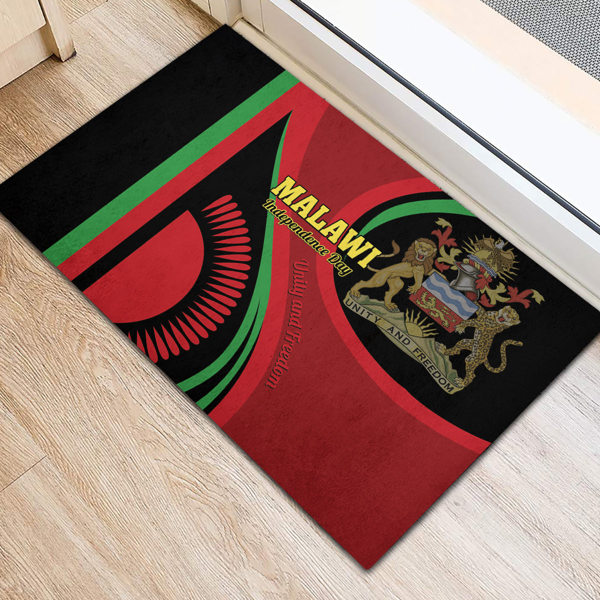 Black rubber doormat near window with red and green Malawi flag and lion crest