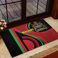 Black rubber doormat at doorway with Malawi flag design, lion emblem, Unity and Freedom text