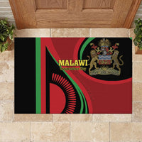 Black rubber doormat on stone tiles with Malawi Independence Day flag and lion emblem