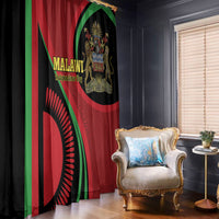 Malawi-themed window curtain draped beside armchair; black red green flag print