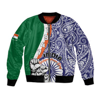 Unisex bomber jacket with green and navy paisley panels, front zipper, ribbed cuffs