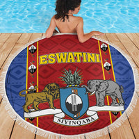 Round blue, red and white beach blanket with animal shield artwork and fringed border