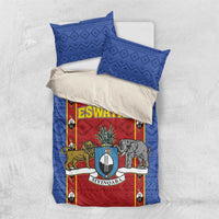 Folded blue bedding set with red shield graphic and matching blue pillowcases