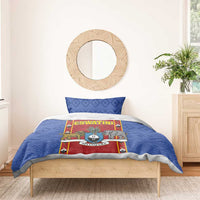 Blue bedding set with African shield graphic, red panel, and matching pillowcases