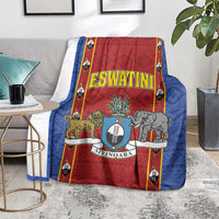 Blue and red blanket with Eswatini shield crest, animals, and bold border accents