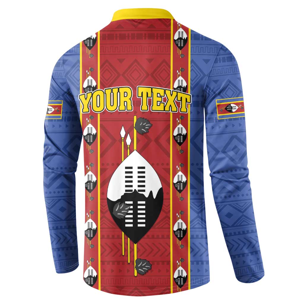 Blue button sweatshirt with red front panel, yellow collar, shield graphic and vertical motif