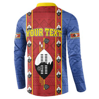 Blue button sweatshirt with red front panel, yellow collar, shield graphic and vertical motif