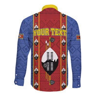 Blue long-sleeve button shirt with red center graphic, yellow trim, and African pattern sleeves