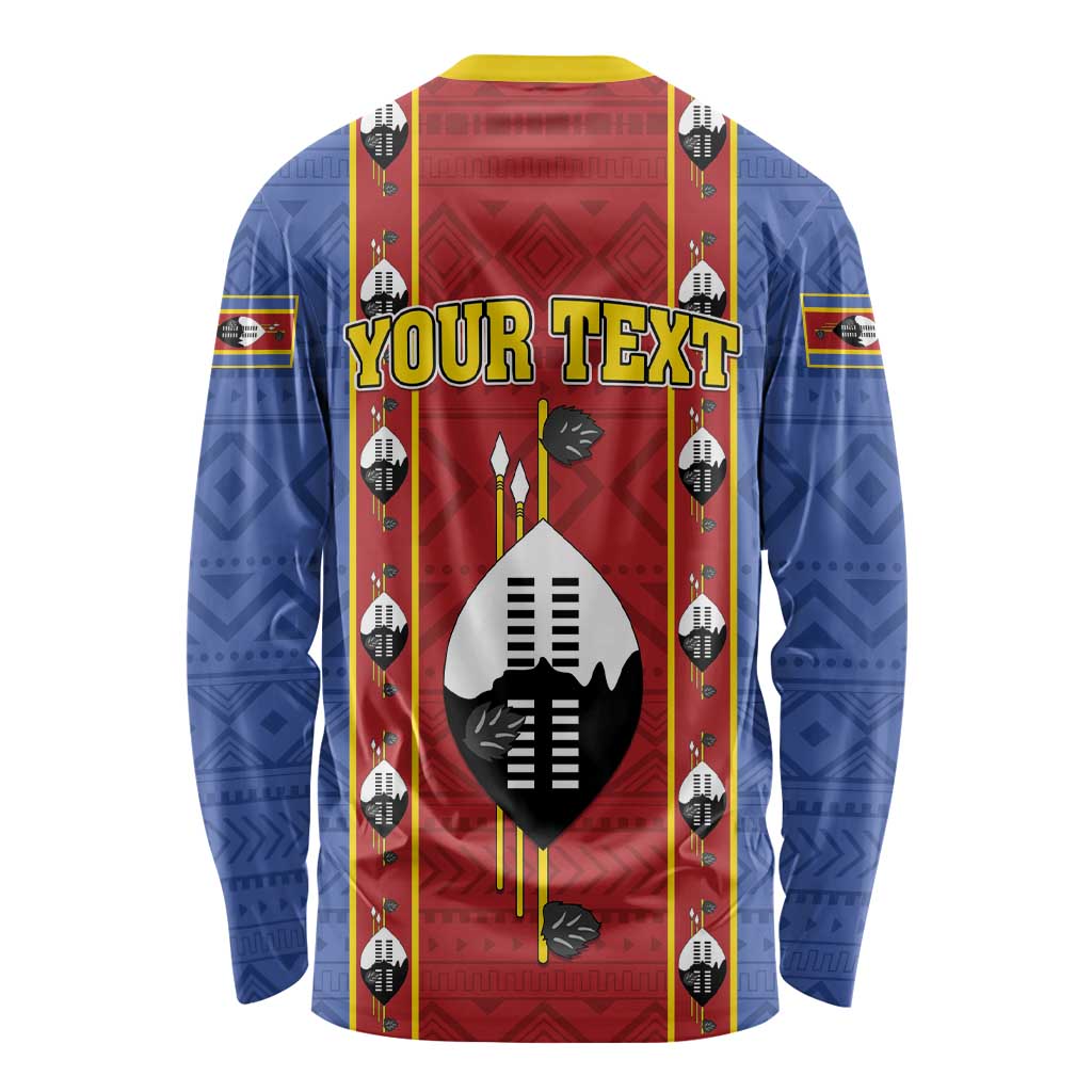 African pattern long sleeve shirt in blue and red, central shield emblem, long sleeves