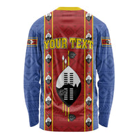African pattern long sleeve shirt in blue and red, central shield emblem, long sleeves