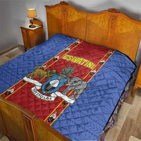 Blue quilt blanket on bed with red ESWATINI shield panel and animal print, quilted diamonds