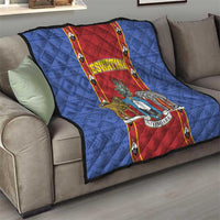 Blue quilt blanket with red center strip, ESWATINI title and animal shield print, on sofa