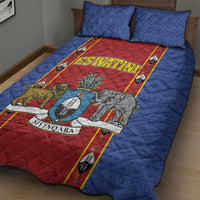 Blue quilt bed set with red ESWATINI shield graphic and matching pillows