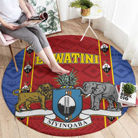 Round African pattern carpet rug with shield banner and animal figures, red center and blue edges
