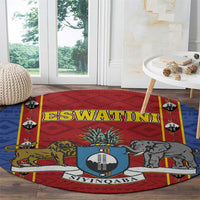 Round African pattern carpet rug with red center shield and animal illustrations, blue border ring
