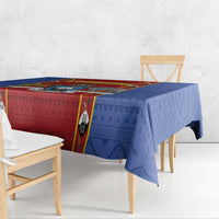 Blue African pattern tablecloth with red center panel and draped edges