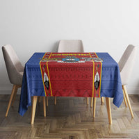 Square tablecloth featuring blue geometric pattern and red central panel
