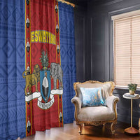 Blue and red shield-themed African pattern window curtain panel beside armchair