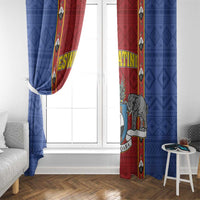 Blue and red African pattern window curtains with shield emblem and elephant figure