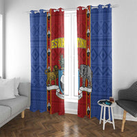 Blue and red African pattern window curtains with shield crest and hanging animal figures
