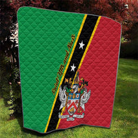Square quilt blanket in green and red with black star stripe and central crest