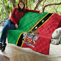 Green and red quilt blanket draped over couch with black stripe, stars, and crest