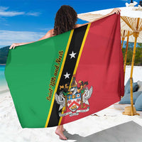 Large green and red flag-print sarong with diagonal black stripe and crest, held up